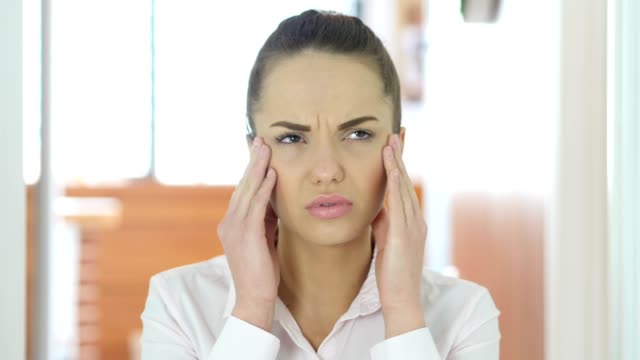 Headache,-Tense-Working-Woman-in-Office