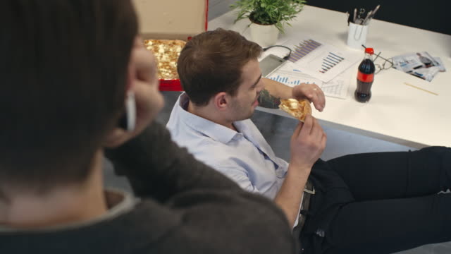 Office-Worker-with-Pizza-Annoying-Colleague