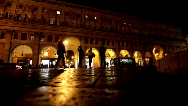 People-go-through-an-old-night-city,-Europe,-Prague,-time-lapse
