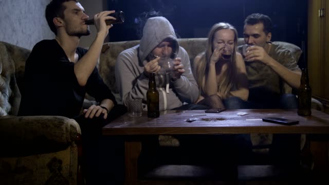 People-abusing-alcohol-and-smoking-marijuana