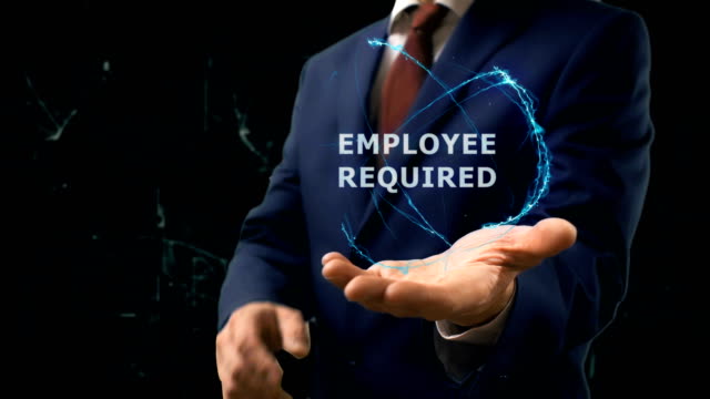 Businessman-shows-concept-hologram-Employee-required-on-his-hand