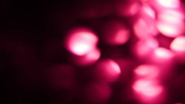 Light-dots-blured-glows.-Lots-of-red-or-purple-color-leaks.-Light-leaks-or-transitions-for-film-composing---real-effect,-not-computer-generated