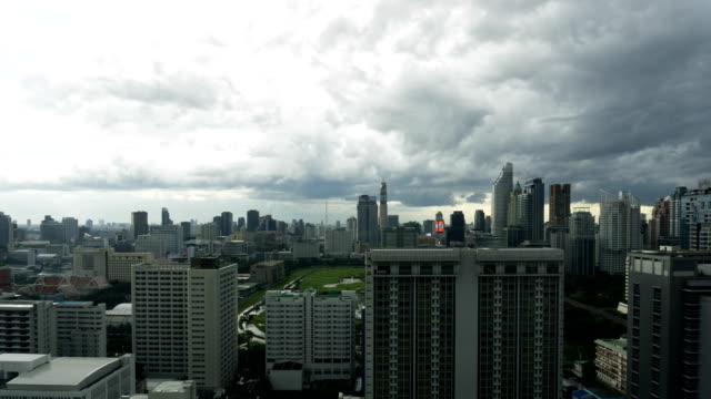 Storm-clouds-with-rain-passing-over-sky-of-Bangkok-cityscape.-4K-Timelapse