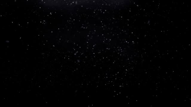 Realistic-beautiful-snowflakes-falling-and-spinning-in-black-space.-Looped-video.