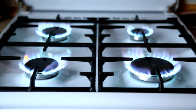 Natural-gas-inflammation-in-stove-burner,-close-up-view