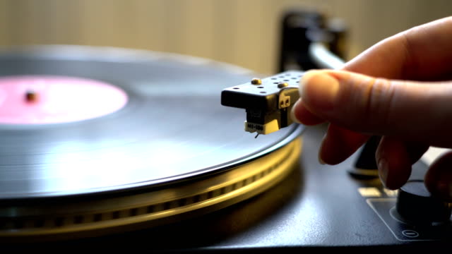 old-style-vinyl-tape-recorder-playing-spinning-plate-with-stylus-needle