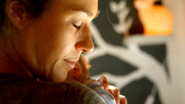 Mother-embracing-her-baby-boy-at-home-4k