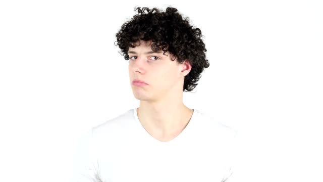 Shaking-Head-to-Reject,-No-by-Young-Man-with-Curly-Hairs,-white-Background