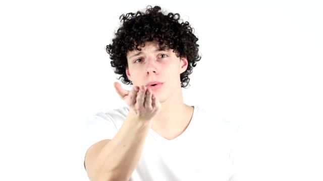 Flying-Kiss-by-Young-Man-with-Curly-Hairs,-white-Background