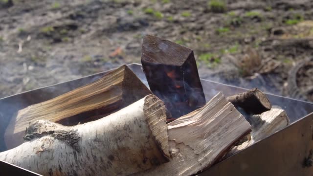 Ignition-of-a-brazier-on-wooden-firewood-slow-motion-video