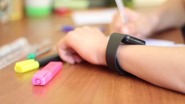 Schoolboy-with-smart-watch-in-the-classroom