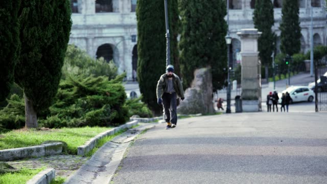 lonely-homeless-man-walks-through-the-streets-of-Rome