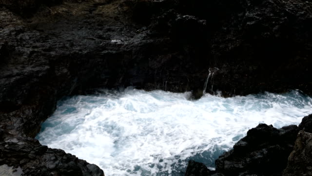 Big-waves-crashing-on-cliff-of-lava-rocks.Time-Lapse.