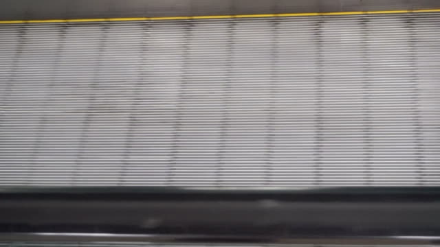 Foot-business-girl-on-escalator