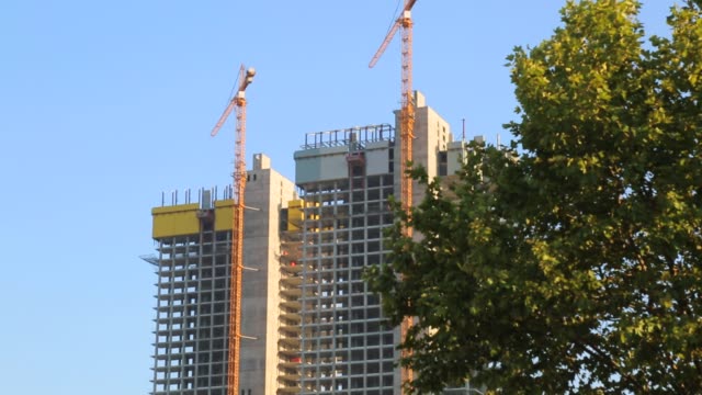 Crane-Works-At-Construction-Site