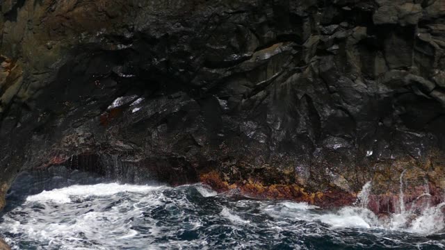 Big-waves-crashing-on-cliff-of-lava-rocks.Slow-motion.
