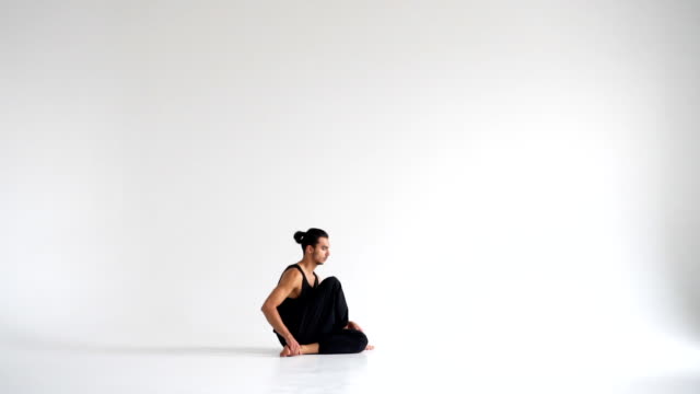 Man-practicing-intense-yoga-asana