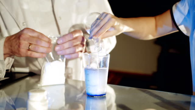 Lab-worker-mixes-chemicals.