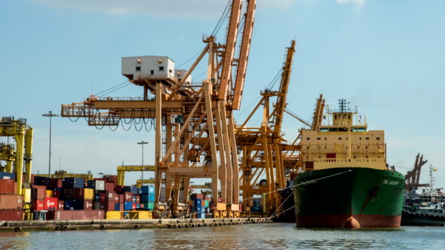 4K-time-lapse-:-working-crane-loading-bridge-in-shipyard