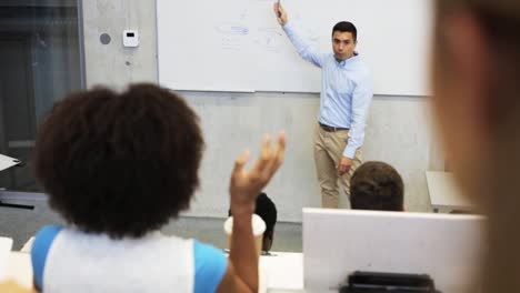 teacher-or-lecturer-at-white-board-in-lecture-hall