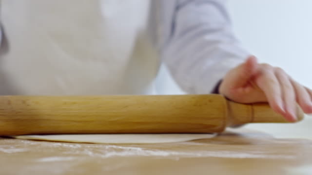 Hands-of-Child-Rolling-Out-Dough