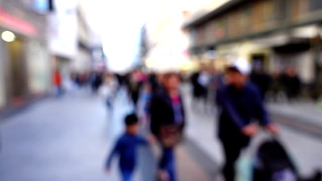 Movement-of-people-along-Fuencarral-street.-Out-of-focus.-Slow-motion.	Madrid,-Spain.