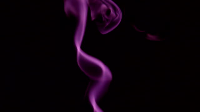 Purple-Steam-Rises-from-up.-Blue-smoke-over-a-black-background.-Smoke-slowly-floating-through-space-against-black-background.-Slow-Motion.
