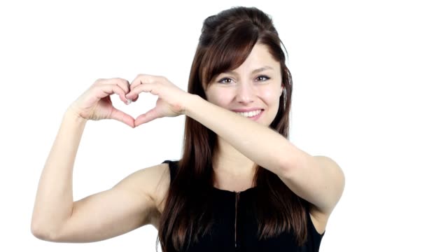 Heart-Sign-by-Young-Girl-in-Love,-White-Background