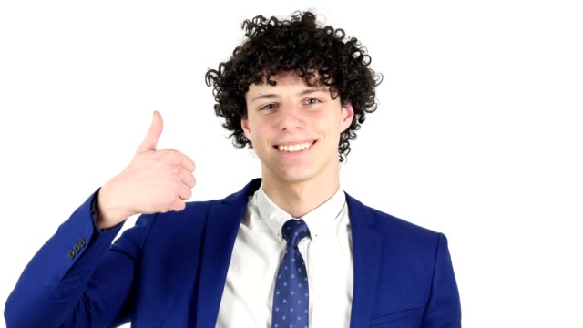 Thumbs-Up-by-Young-Businessman,-White-Background