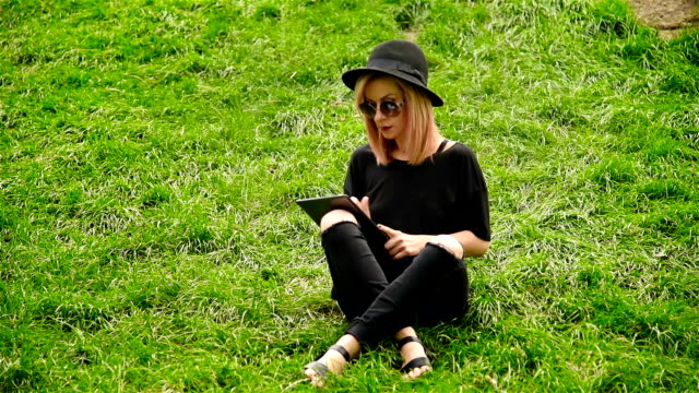 Girl-Sitting-On-Grass