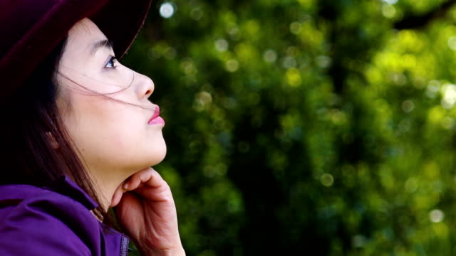 closeup-portrait-of-sad-depressed-young-asian-woman-outdoor