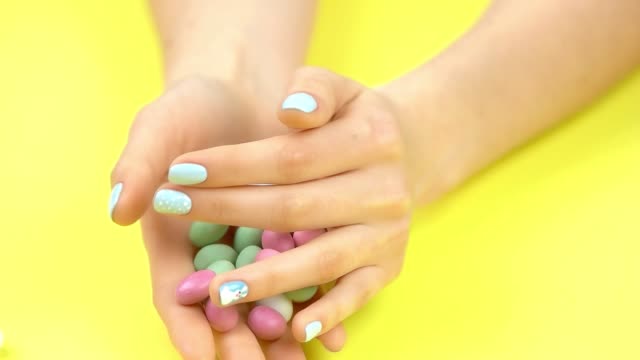 Candies-falling-from-hands,-slow-motion.
