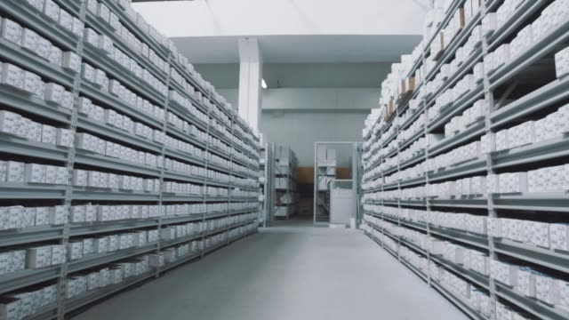 Bright-storehouse-shelves-full-of-white-boxes-with-numbers-markings