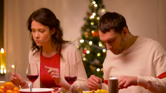happy-couple-eating-at-christmas-dinner