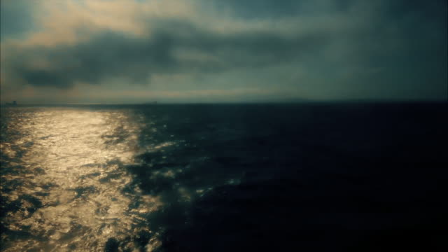 Soft-focus-sea-at-sunset-through-a-ships-window