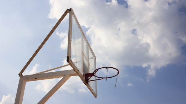 Outdoor-Basketball-cage-stand-beautiful-clouds-moving