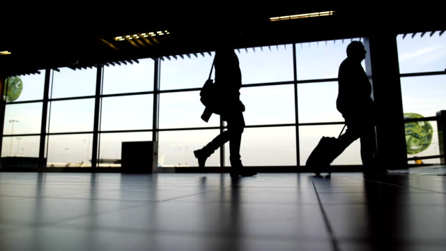Bottom-view-of-passenger-legs-walking-at-airport-terminal,-travel,-vacation