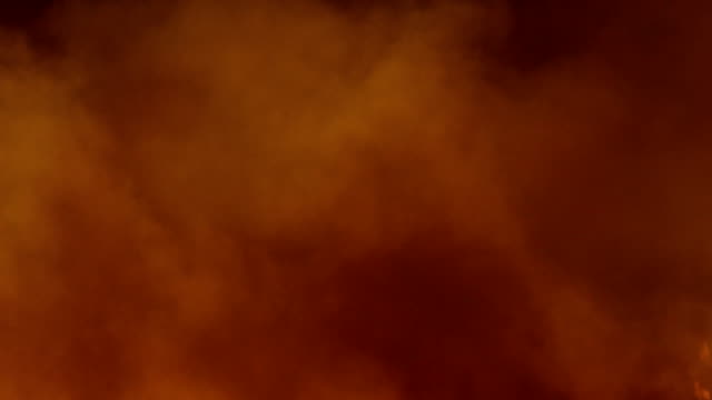 Orange-smoke-isolated-on-black-background