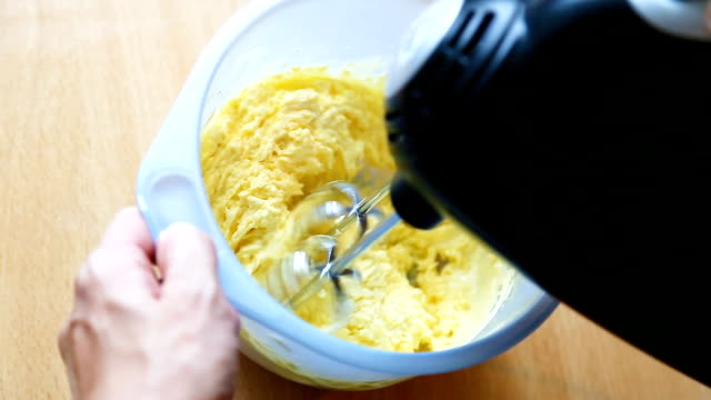 Closeup-preparation-of-whipped-cream-with-a-electric-mixer