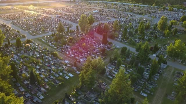 Aerial-of-Cemetery-with-Trees-at-Sunset