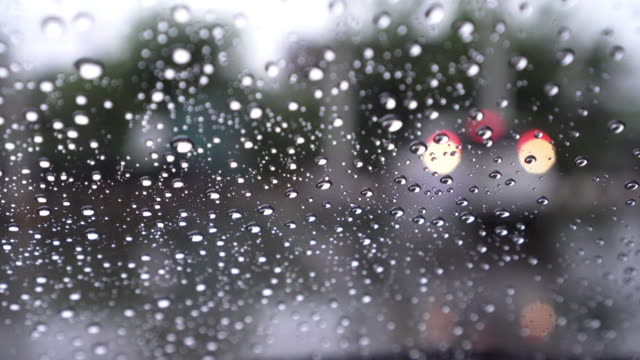 Car-windshield-with-rain-drops