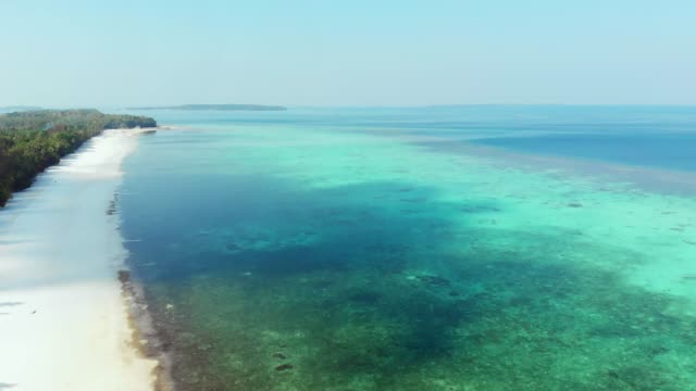 Aerial:-flying-over-tropical-beach-island-coral-reef-turquoise-caribbean-sea.-Indonesia-Moluccas-archipelago,-Kei-Islands,-Pasir-Panjang,-Banda-Sea.-Top-travel-destination,-best-diving-snorkeling,-stunning-panorama.