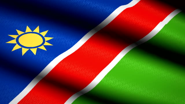 Namibia-Flag-Waving-Textile-Textured-Background.-Seamless-Loop-Animation.-Full-Screen.-Slow-motion.-4K-Video