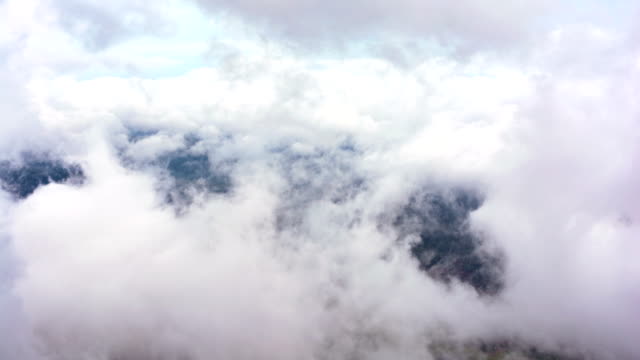 Beautiful-waves-of-low-clouds-flows-in-winter-mountains---time-lapse
