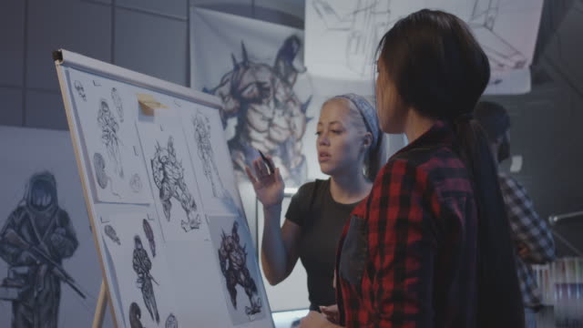 Diseñadoras-femeninas-discutiendo-arte-de-videojuegos