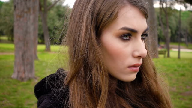 portrait-of-Beautiful-thoughtful-and-angry-woman-at-the-park