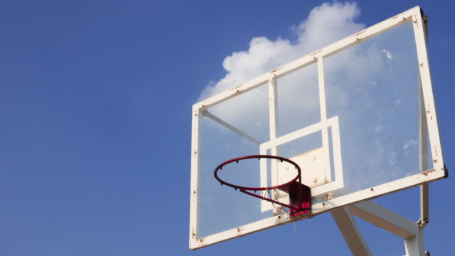 In-Time-lapse-of-Basketball-cage-against-beautiful-clouds-moving