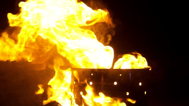 Fire-flame-close-up-loopable.-Closeup-of-fire-burning-on-black-background-in-slow-motion.