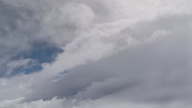 Airplane-flying-through-a-cloudy-sky.-Aerial-view-footage
