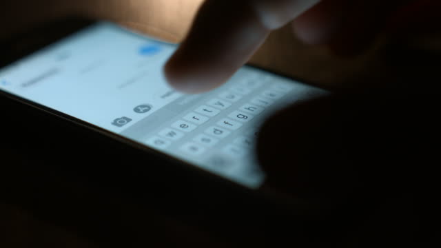 Fingers-typing-a-message-on-the-smartphone.-Close-up